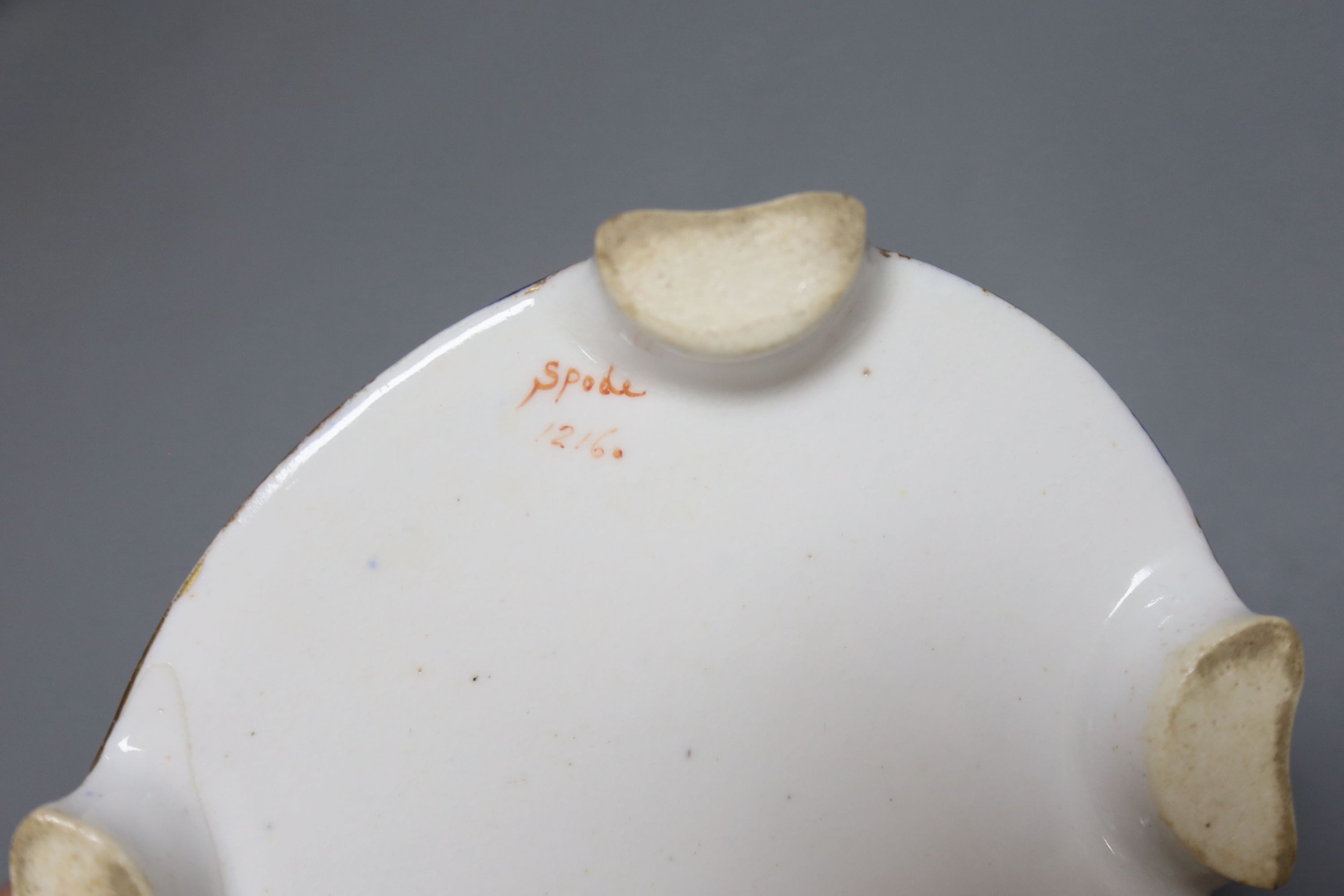 A 19th century English porcelain inkstand, a basket and associated cover and a Spode base, tallest 20cm